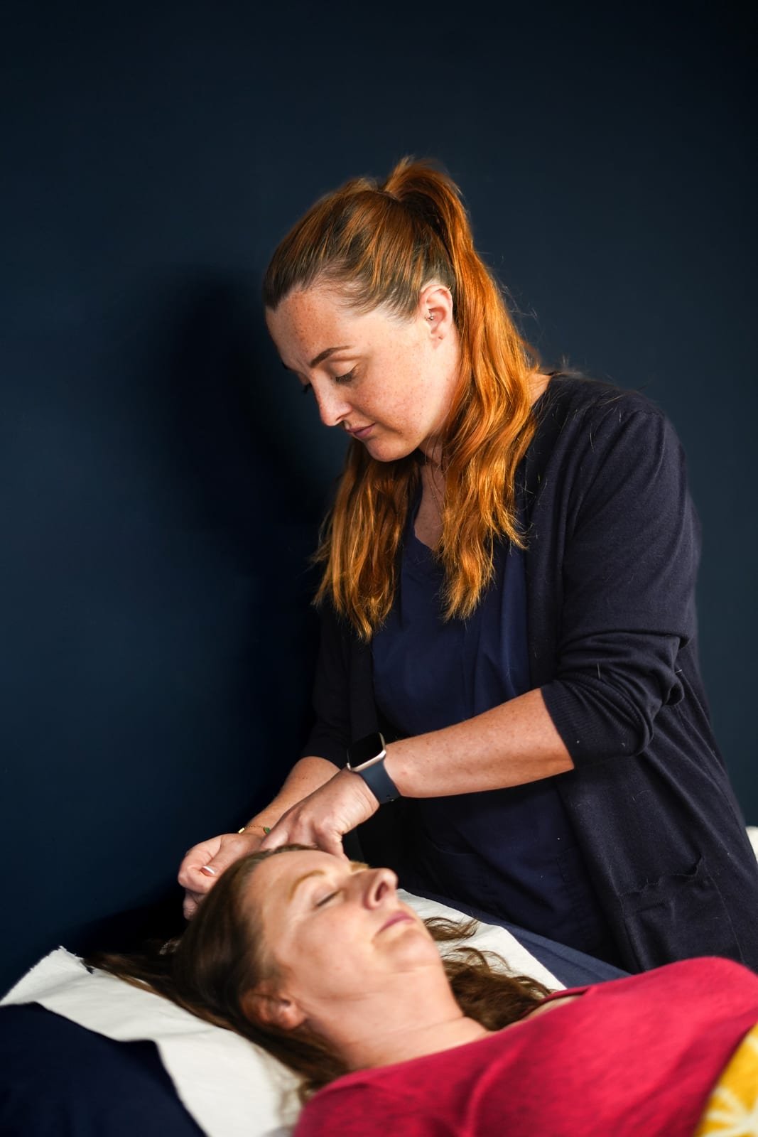 Acupuncture needle placed at the Du20 point